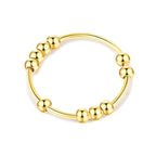 Anillo Antiestrés con Perlas Giratorias para Hombre o Mujer oro