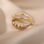 Anillo Antiestrés con Perlas Giratorias oro