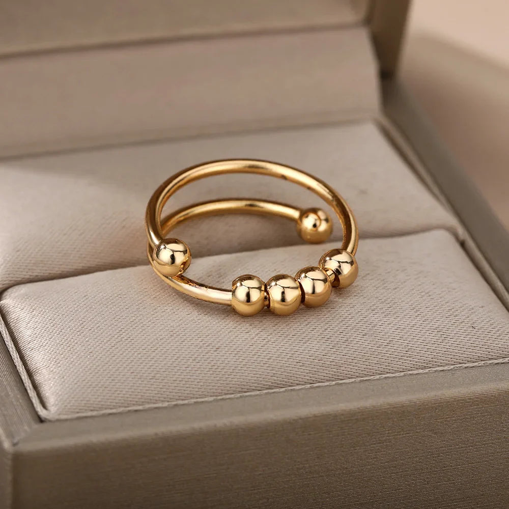 Anillo Antiestrés con Perlas Giratorias oro