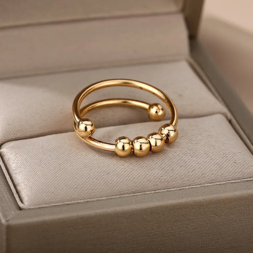 Anillo Antiestrés con Perlas Giratorias oro
