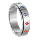 Anillo con corazones o patas antiestrés giratorio patas