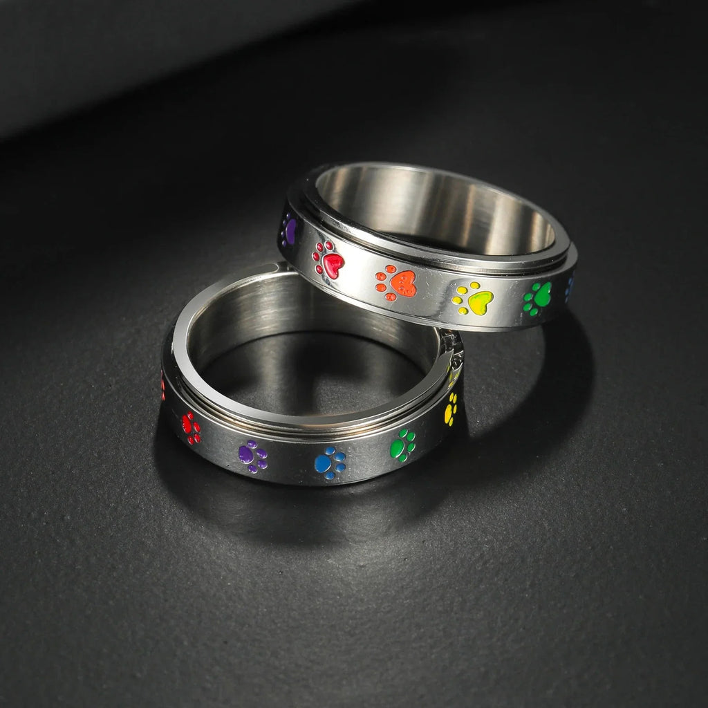 Anillo con corazones o patas antiestrés giratorio corazón
