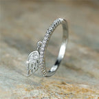 Bague avec pendentif ailes d'ange