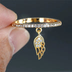 Bague avec pendentif ailes d'ange