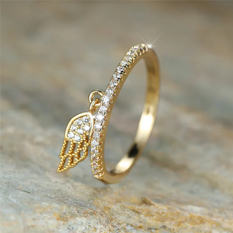 Bague avec pendentif ailes d'ange