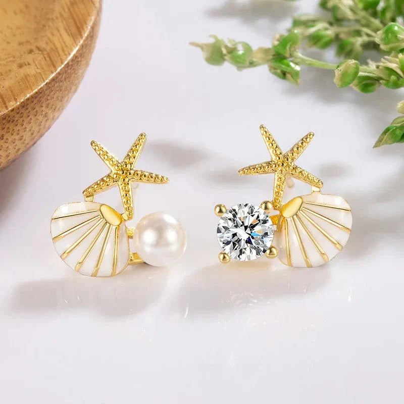 Pendientes de Clavo con Conchas y Perla