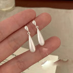 Pendientes de botón gota de agua en circonio blanco