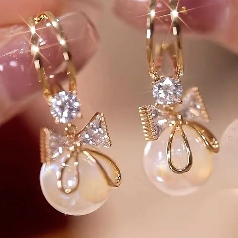 Pendientes Colgantes con Lazo de Mariposa y Perla