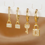 Boucles d'oreilles rondes clef et cadenas avec strass