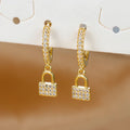 Boucles d'oreilles rondes clef et cadenas avec strass