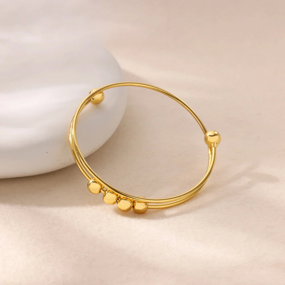 Pulsera con Perlas Giratorias Antiestrés para Hombre o Mujer oro
