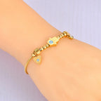 Pulsera de Protección con Mano de Fátima y Ojo Azul oro
