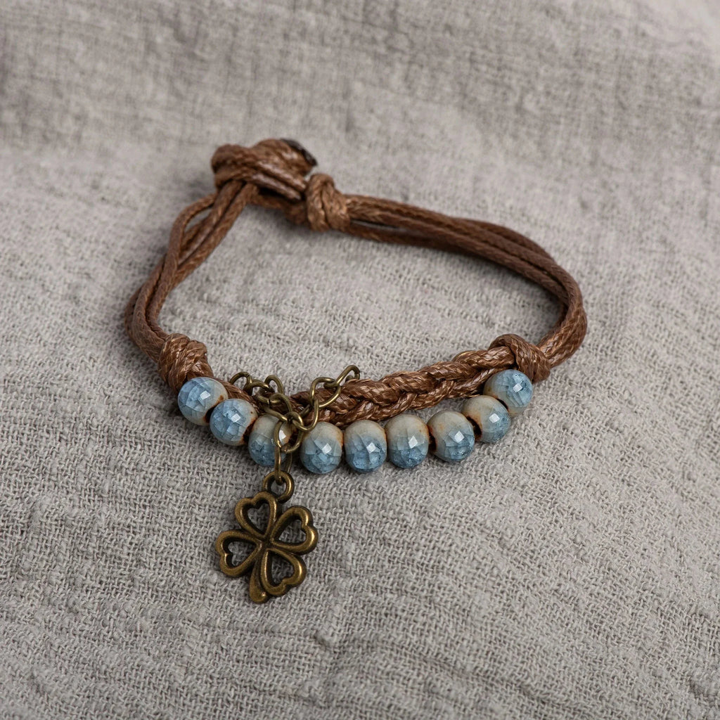 Pulsera de Cuerda con Trébol de 4 Hojas y Perlas azules