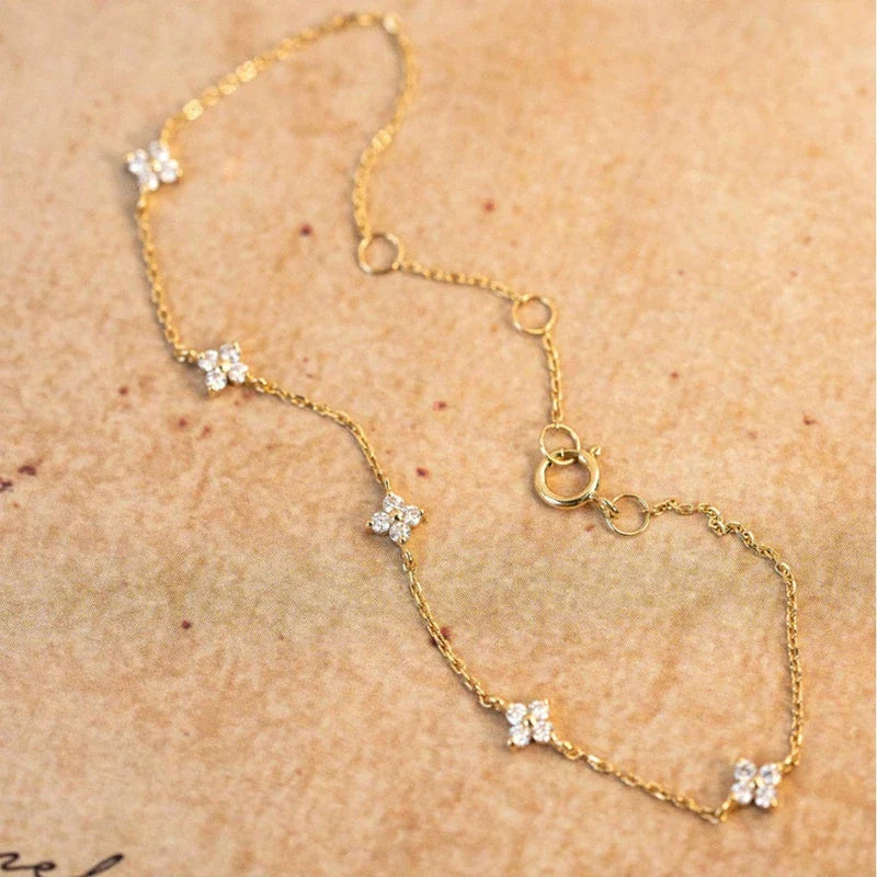 Pulsera Gourmette con Finas Flores en Zirconio oro