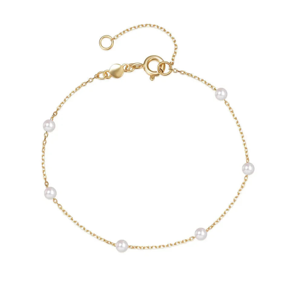 Pulsera fina cadena con perlas blancas