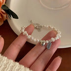 Pulsera Gourmette para Mujer con Perlas y Corazón
