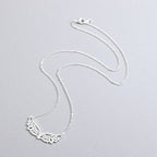 Collier avec large pendentif ailes d'ange