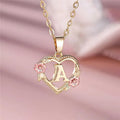 Collier avec pendentif initiale coeur et fleurs - lettre
