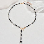 Collar con Perlas y Colgante Nudo