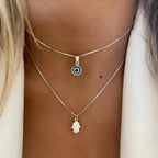 Collar Doble con Colgante Ojo Azul Turco y Mano de Fátima plata