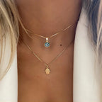 Collar Doble con Colgante Ojo Azul Turco y Mano de Fátima oro