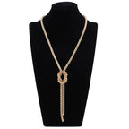 Collier long avec pendentif noeud