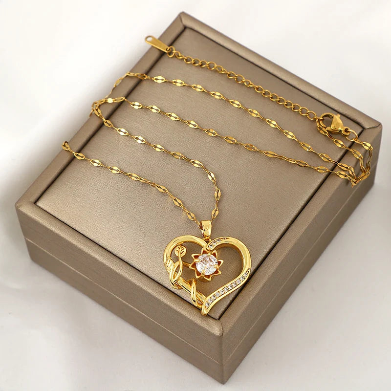 Collar Colgante con Corazón y Flor Giratoria Anti-Estrés