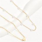 Collar con colgante de corazón y perlas