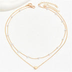 Collar con colgante de corazón y perlas