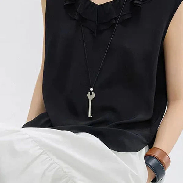 Long collier en corde avec pendentif clef
