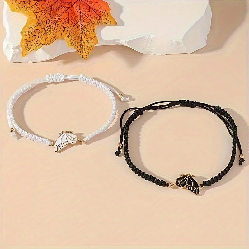Set de 2 Pulseras Ala de Mariposa para Mejores Amigos negro y blanco
