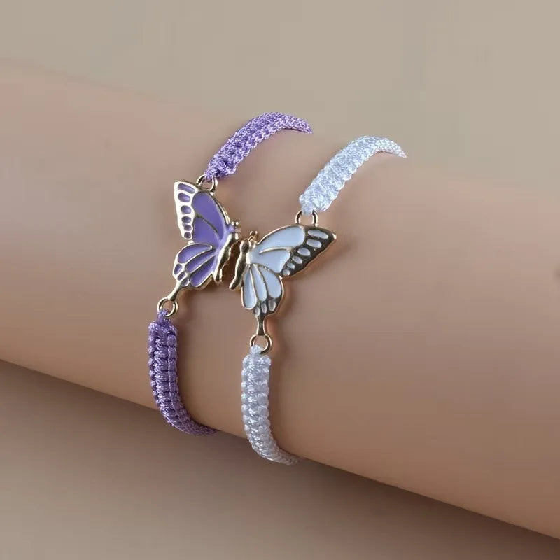 Set de 2 Pulseras Ala de Mariposa para Mejores Amigos violeta y blanco