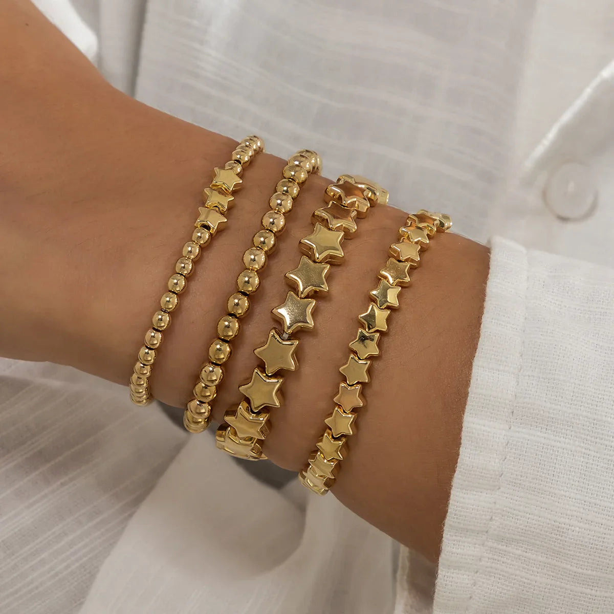 Lote de 4 Pulseras Estrellas oro