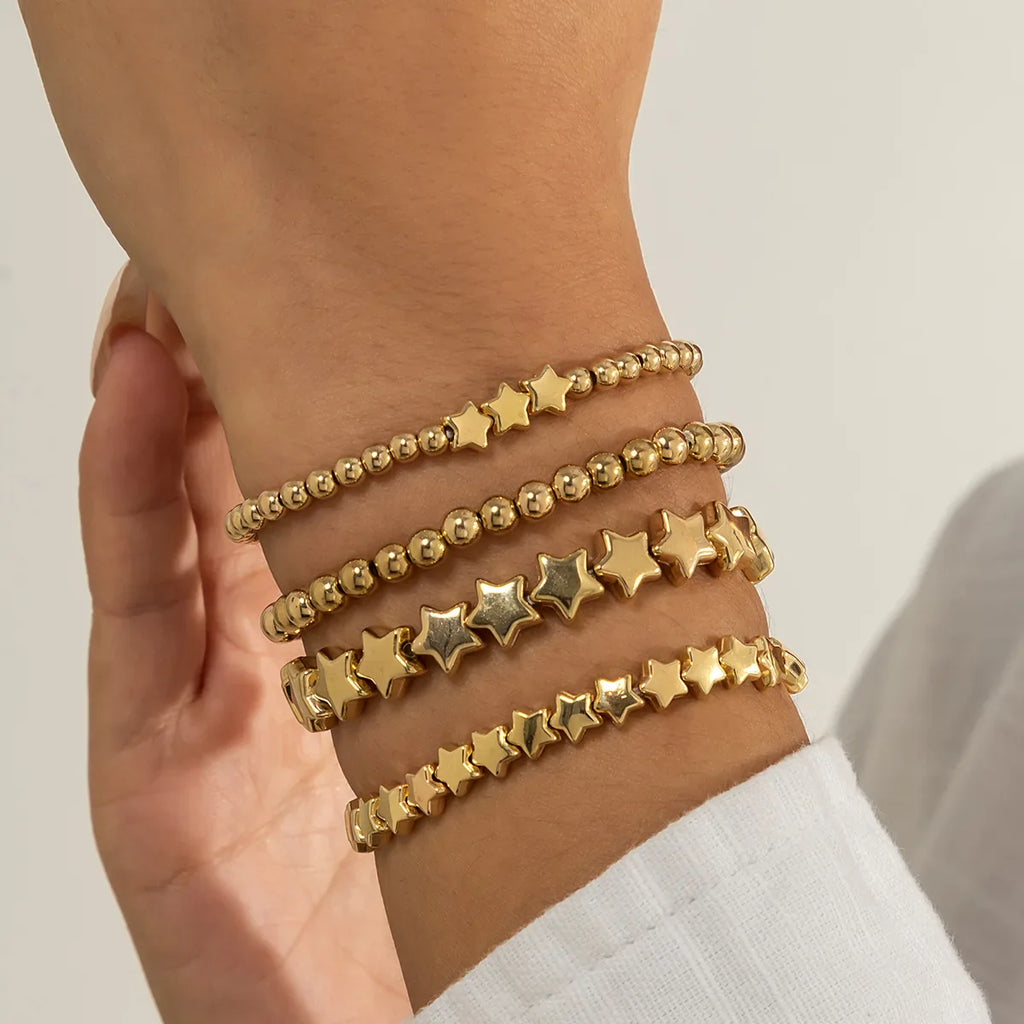 Lote de 4 Pulseras Estrellas oro